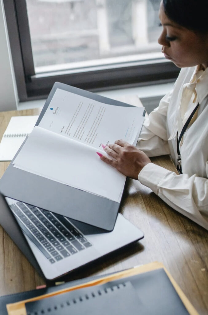 Compliance Analyst is looking at documents