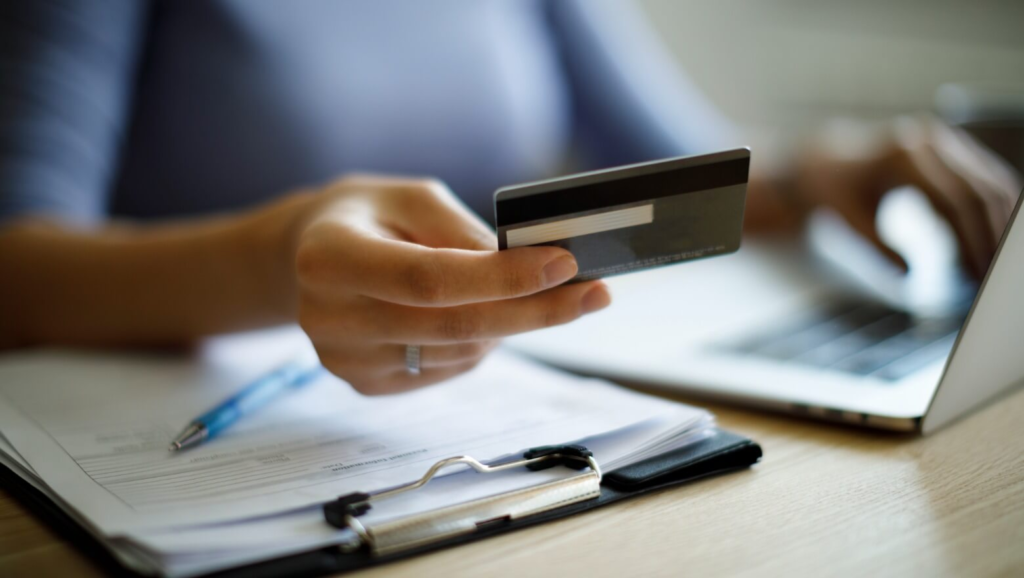 Hand holding a credit card