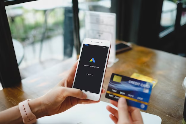 Hands holding credit card and smartphone