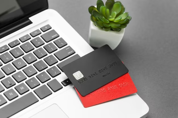 Two credit cards on a laptop