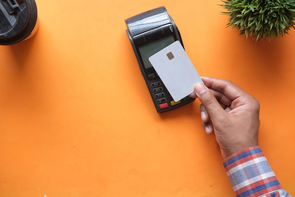 a person brings a card to the terminal